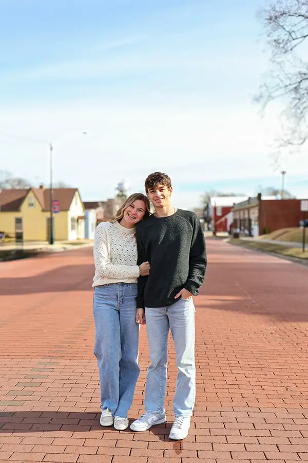 Couple standing on a brick main street