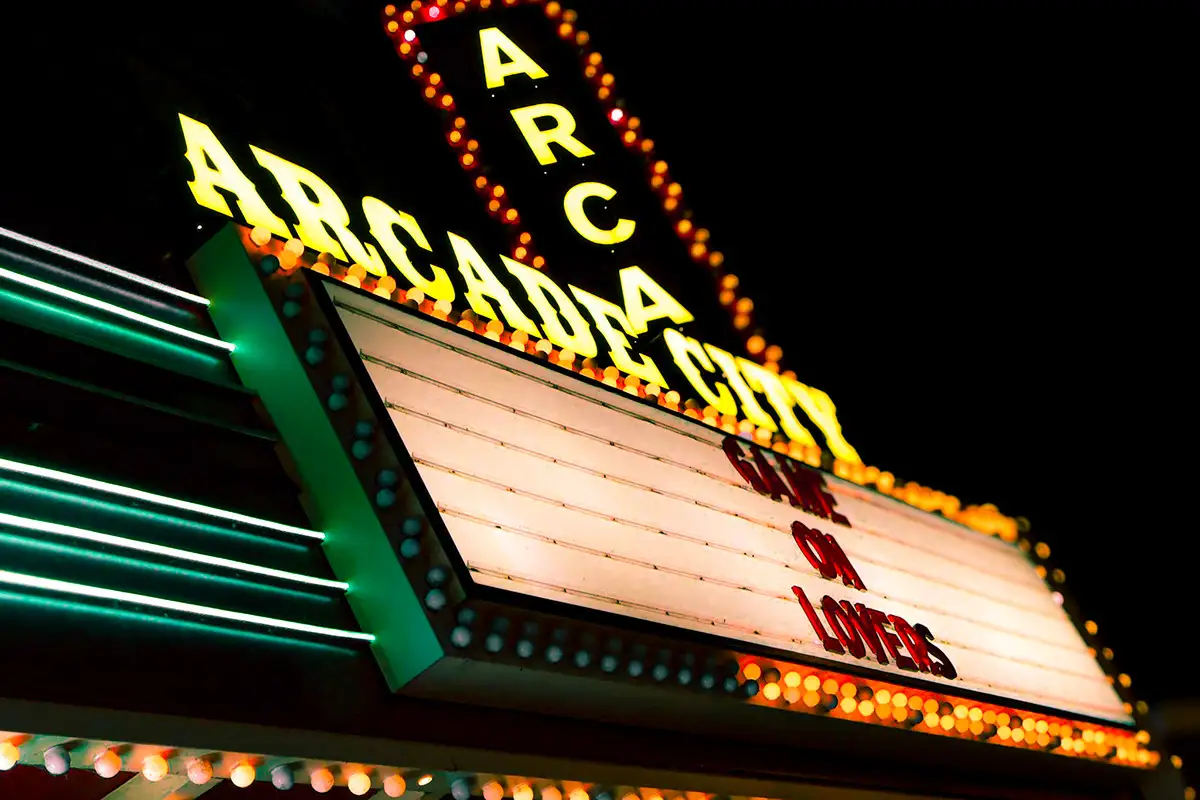 Close-up of the Arcade City marquee and its neon