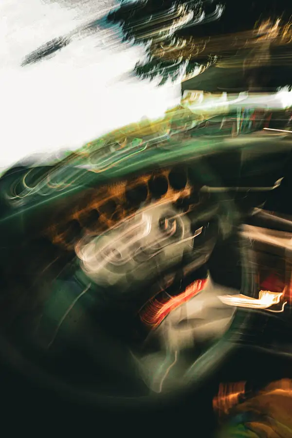 Abstract motion-blurred street scene in green and red