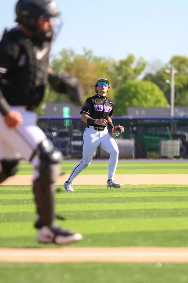 Baserunner heading for home past the catcher