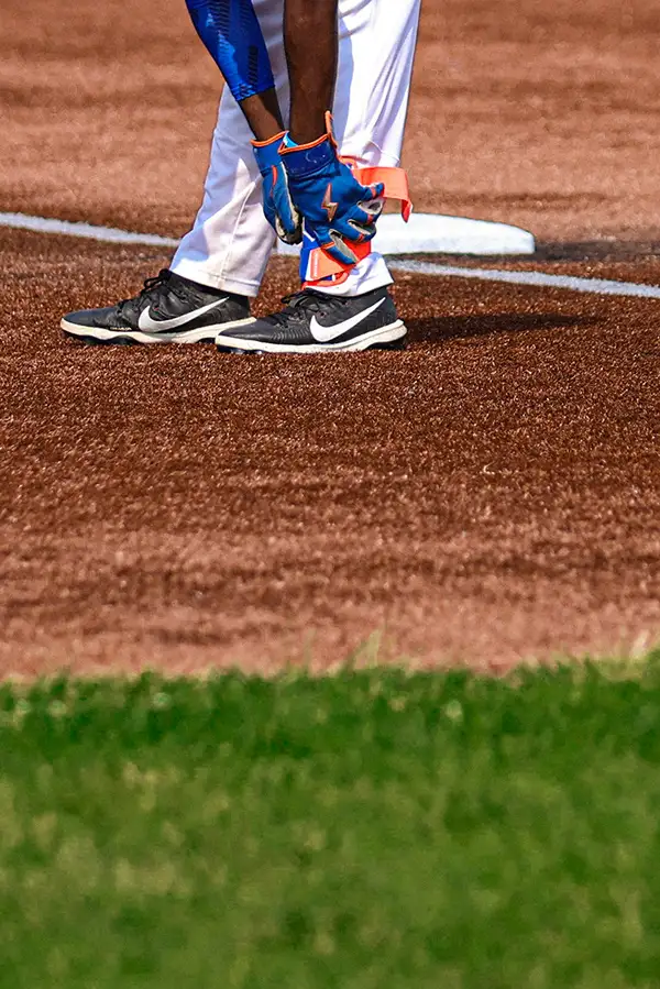 Close-up of a baseball player's cleats on the bag